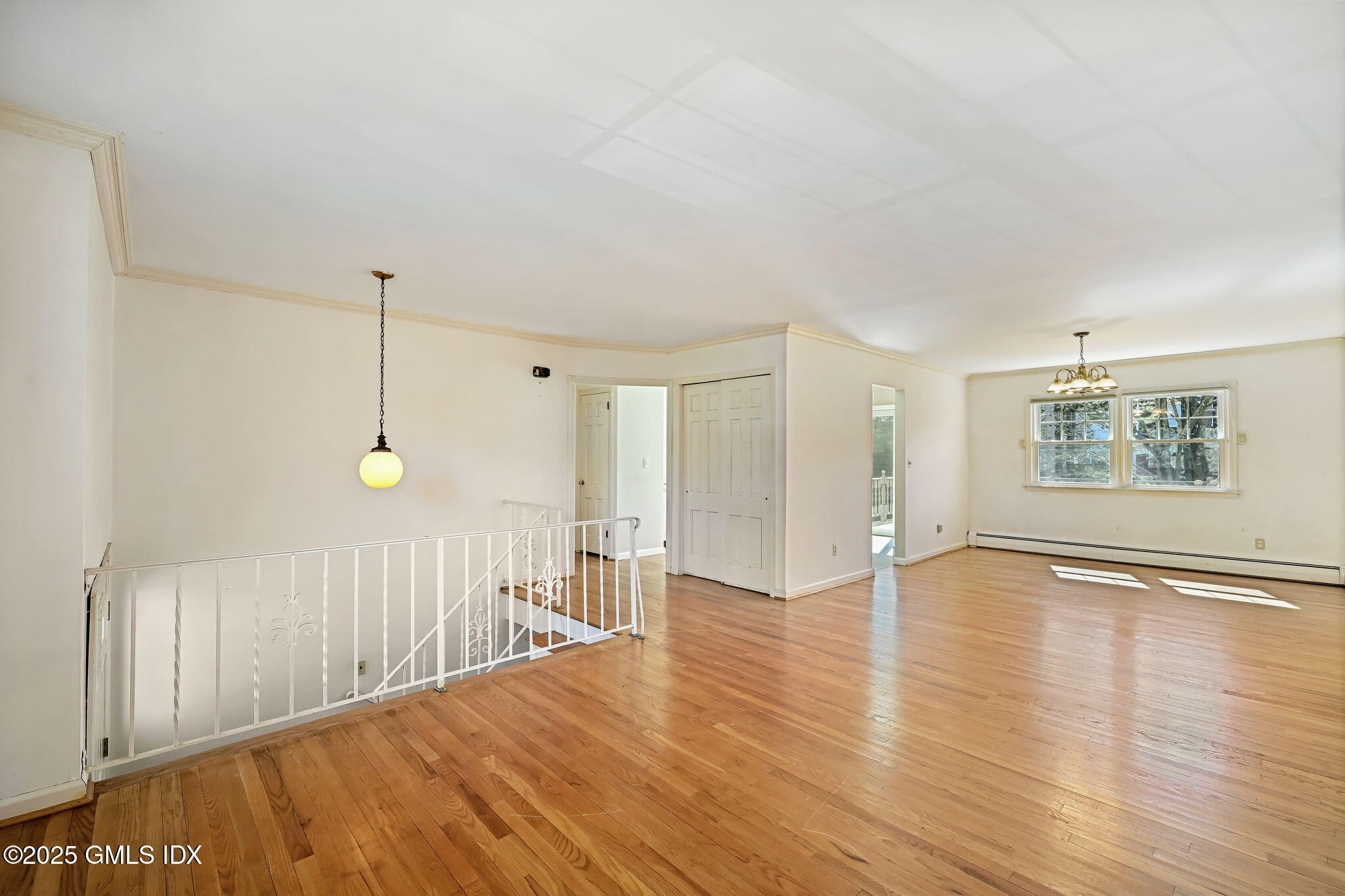 12 Griffith Road Riverside, CT 06878 - Photo 3 of 13 a view of an empty room with wooden floor and a window