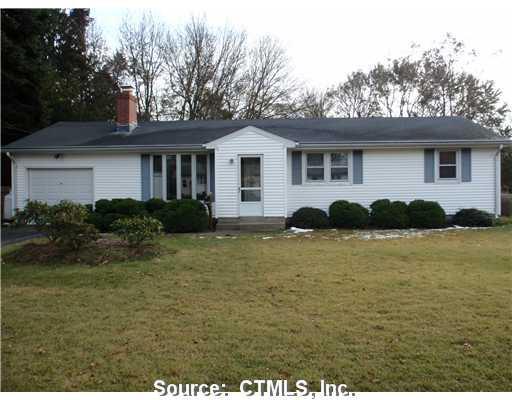 a house view with outdoor space and garden