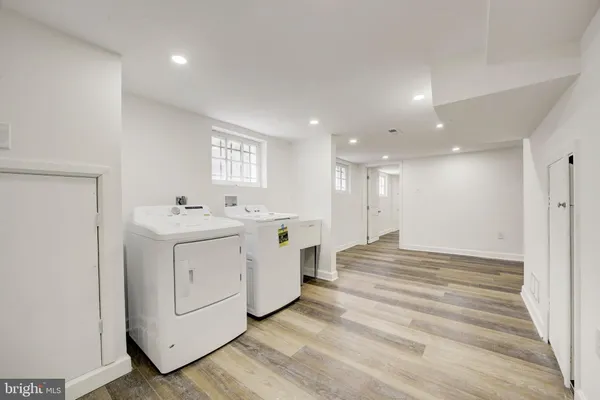 a view of a hallway with washer and dryer
