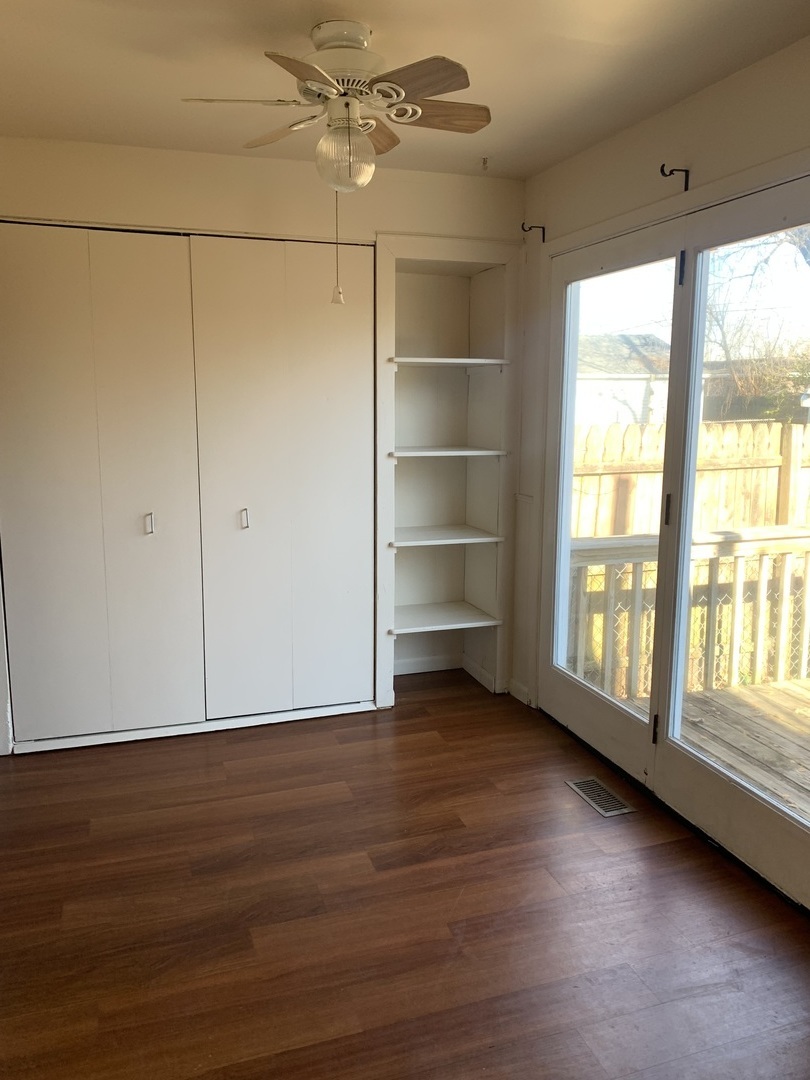 3637 Morgan Street Steger, IL 60475 - Photo 3 of 9 a view of an empty room with a window and wooden floor