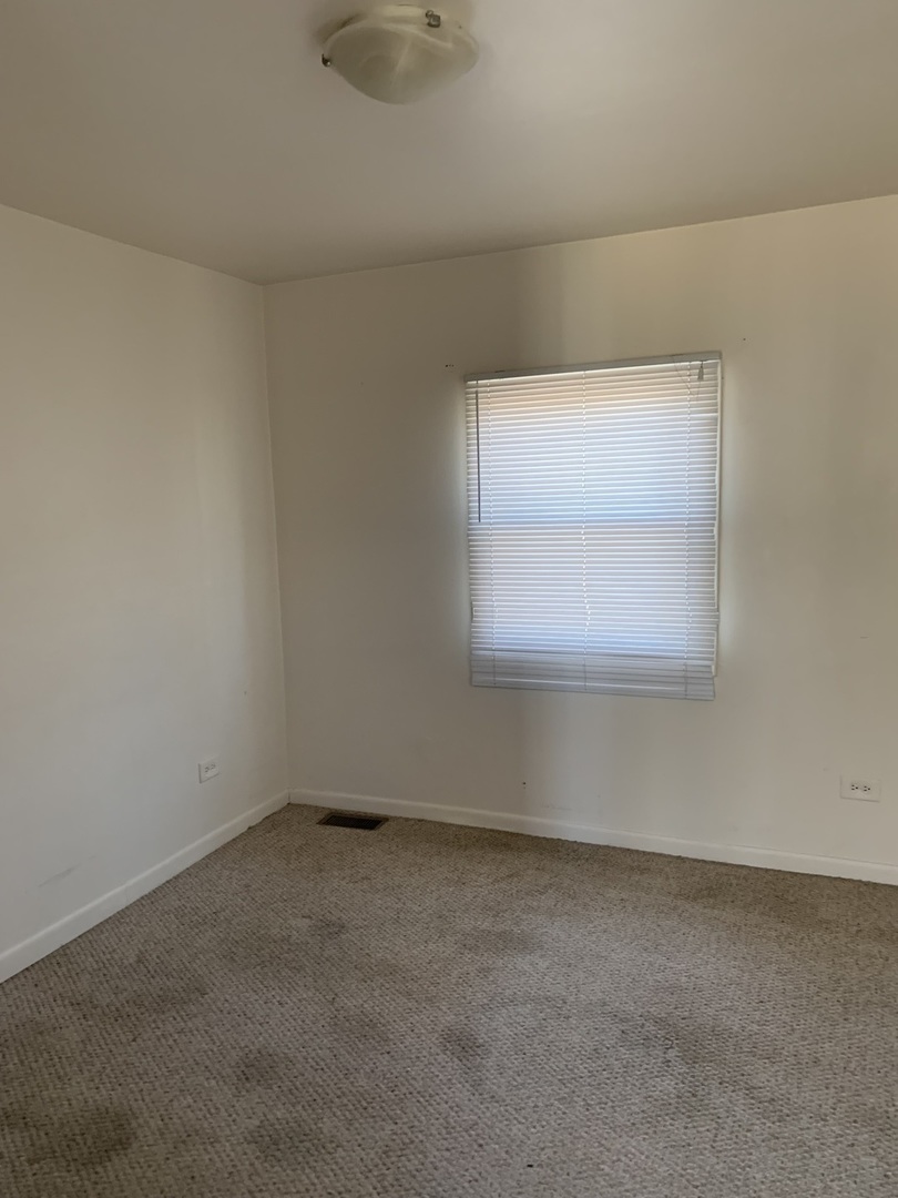 3637 Morgan Street Steger, IL 60475 - Photo 7 of 9 an empty room with a window