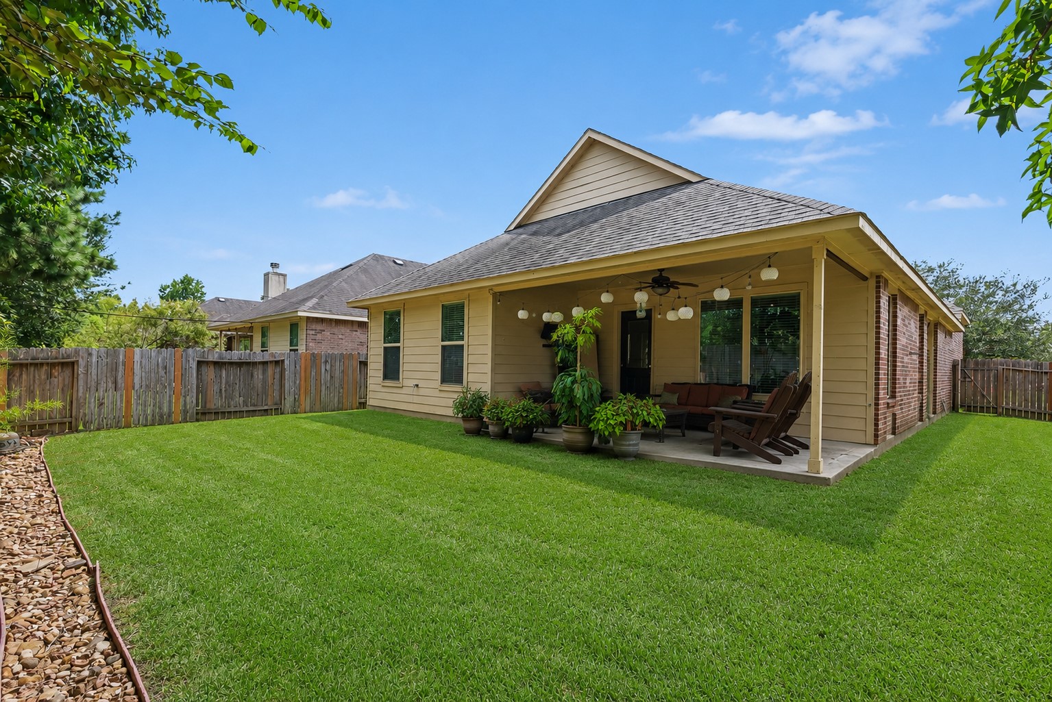 22222 Forbes Field Trail Spring, TX 77389 - Photo 23 of 23 The backyard with a covered patio to lounge about during the cooler months
