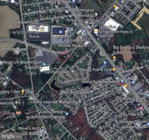 an empty room with windows and fireplace