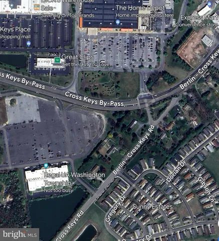 a view of walk in closet with wooden floor