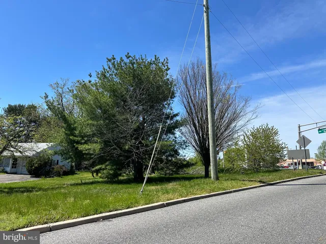 a view of a street with a building in the background