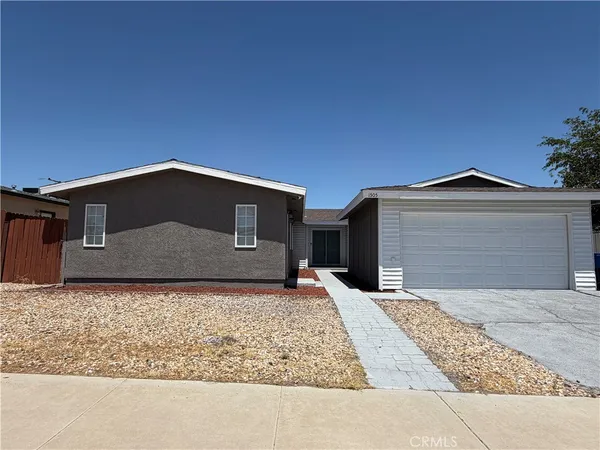 a front view of a house with yard