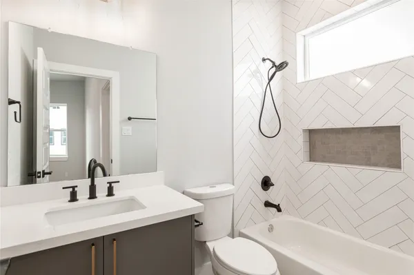 a bathroom with a sink a toilet and a bathtub