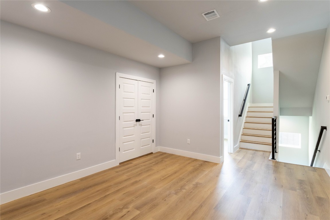 711 Boundary Street Houston, TX 77009 - Photo 15 of 26 a view of a room with wooden floors and stairs