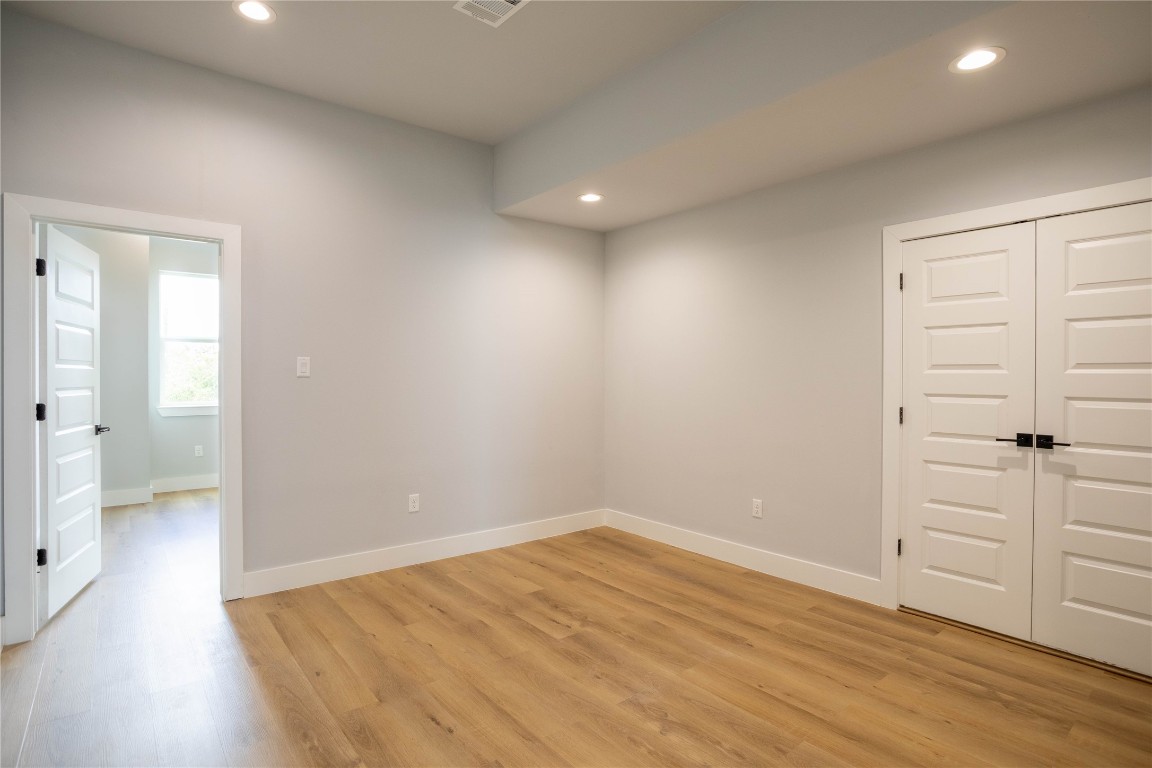 711 Boundary Street Houston, TX 77009 - Photo 16 of 26 wooden floor in an empty room