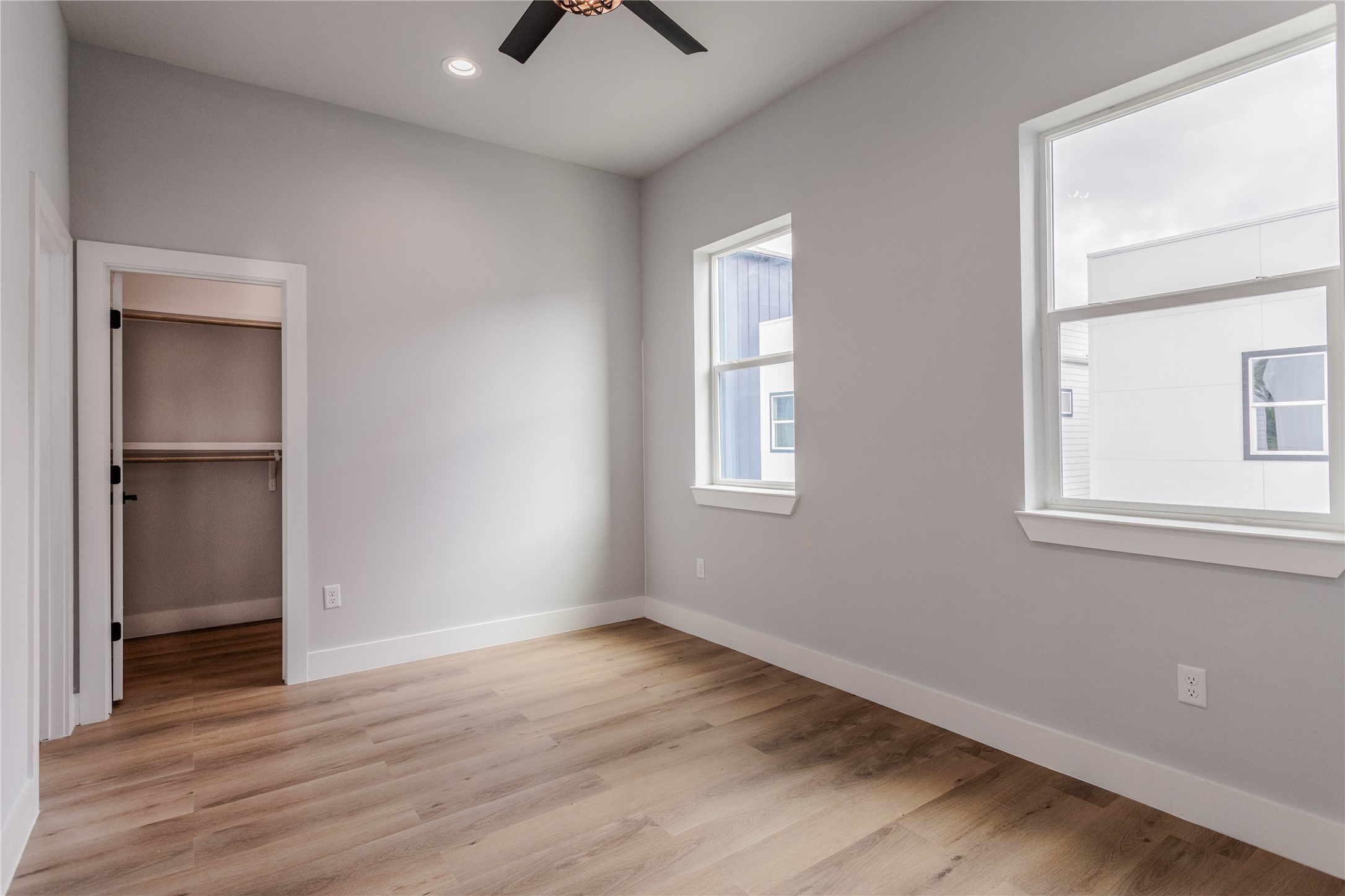 711 Boundary Street Houston, TX 77009 - Photo 23 of 26 an empty room with wooden floor and windows