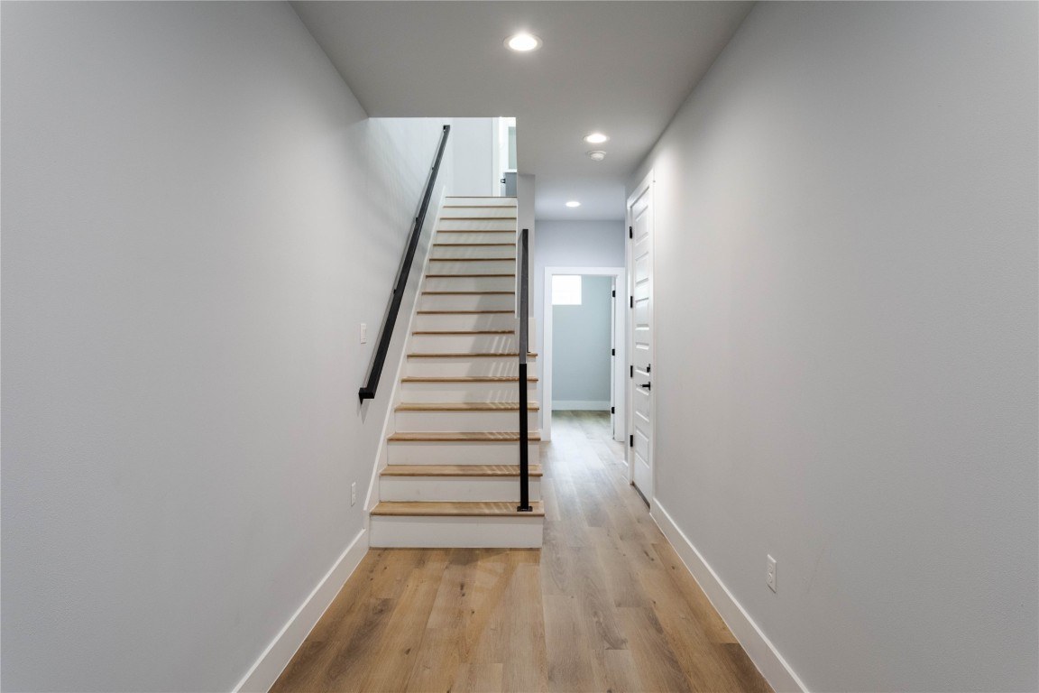 711 Boundary Street Houston, TX 77009 - Photo 3 of 26 a view of a hallway with wooden floor and entryway