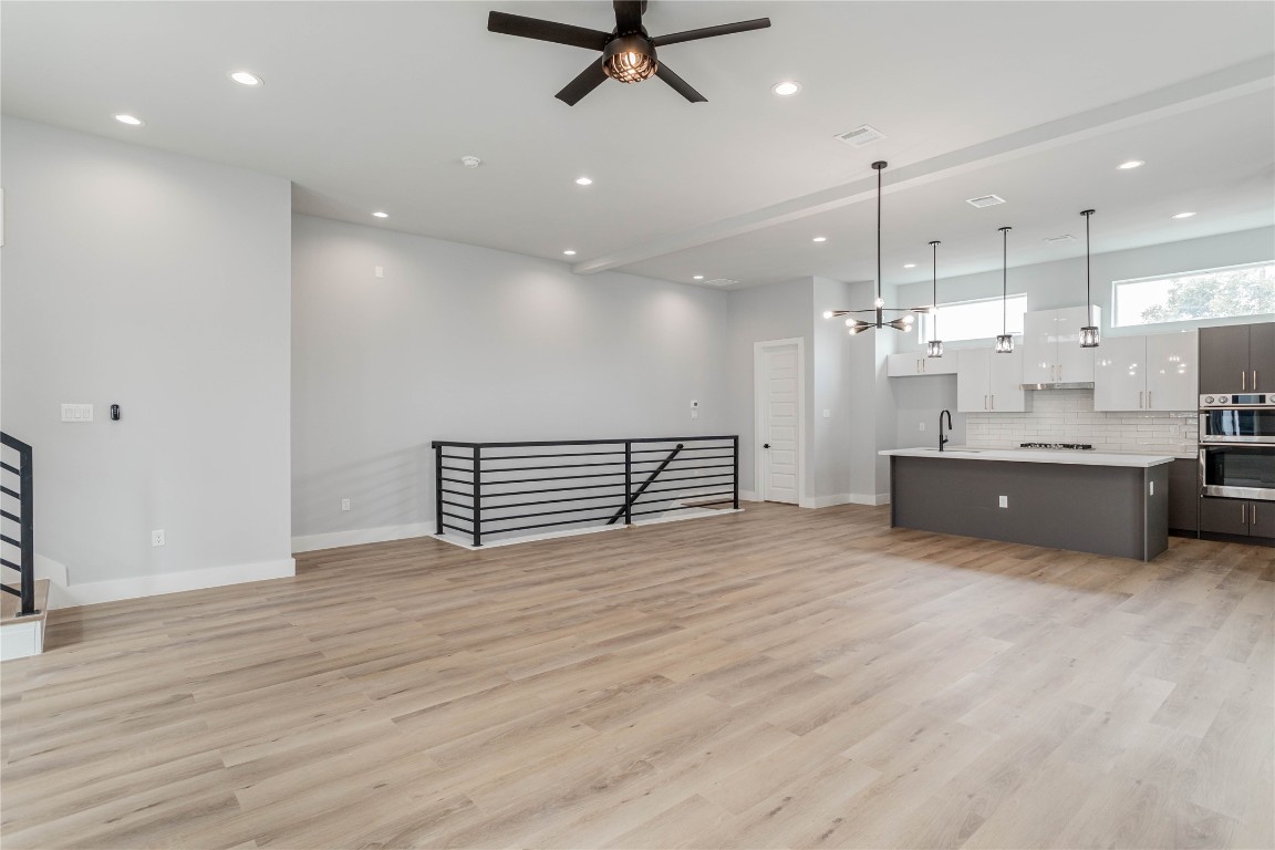 711 Boundary Street Houston, TX 77009 - Photo 9 of 26 a view of an empty room with a kitchen