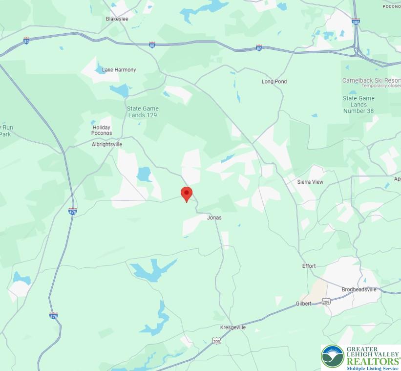 119 Seneca Road Albrightsville, PA 18210 - Photo 3 of 5 a white vase with flowers on it