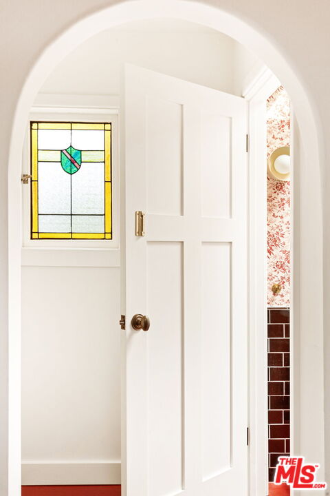 8577 Brier Drive Los Angeles, CA 90046 - Photo 13 of 39 a bathroom with a painting on the wall and a shower