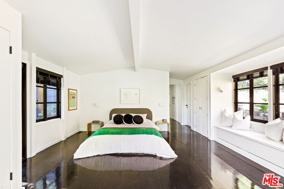 8577 Brier Drive Los Angeles, CA 90046 - Photo 19 of 39 a room with a bed and a large window