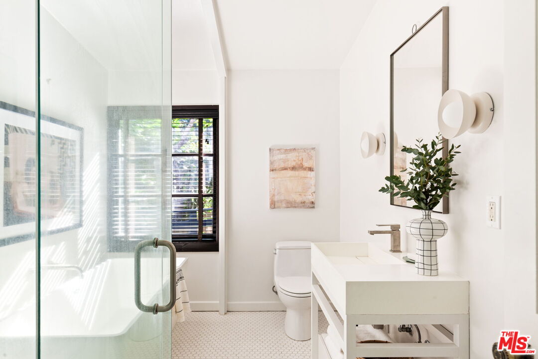 8577 Brier Drive Los Angeles, CA 90046 - Photo 23 of 39 a bathroom with a sink toilet and shower