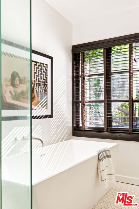 8577 Brier Drive Los Angeles, CA 90046 - Photo 24 of 39 a bathroom with a bathtub and next to a window