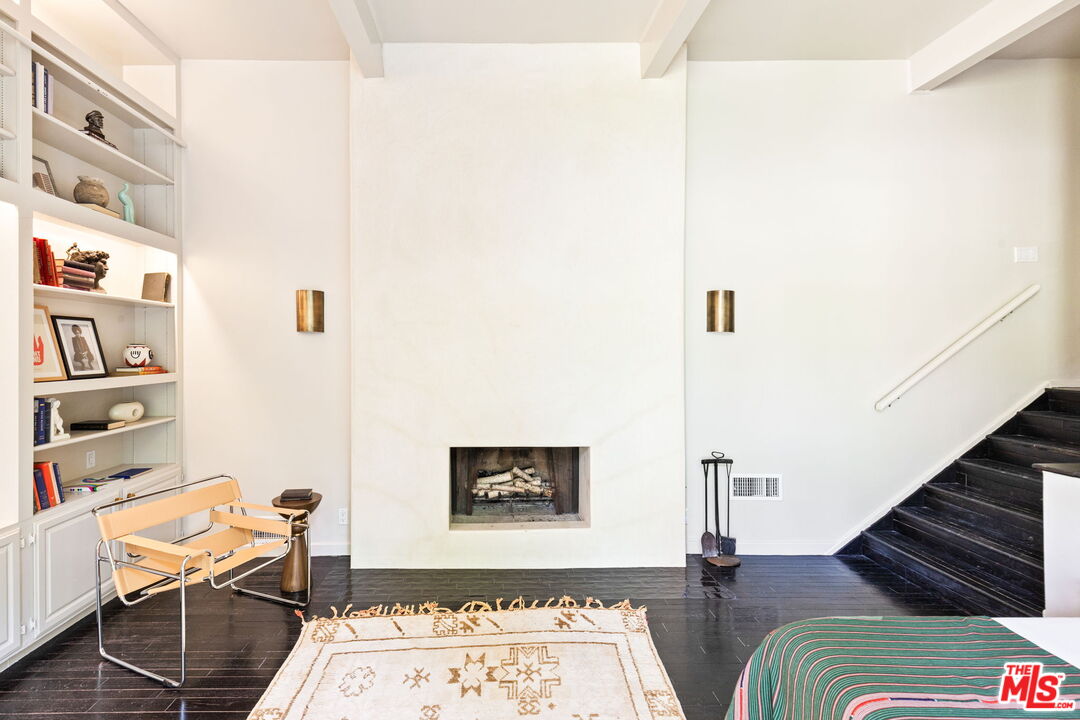 8577 Brier Drive Los Angeles, CA 90046 - Photo 30 of 39 a view of a hallway with furniture and paintings on the wall