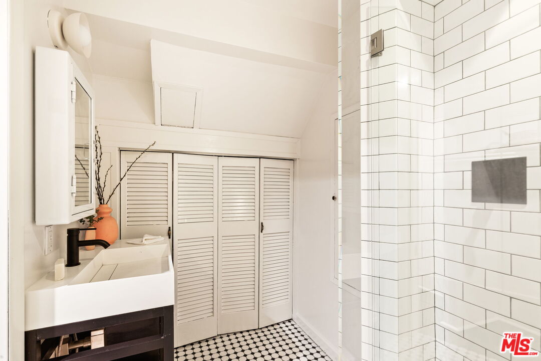 8577 Brier Drive Los Angeles, CA 90046 - Photo 32 of 39 a bathroom with a sink a toilet and shower