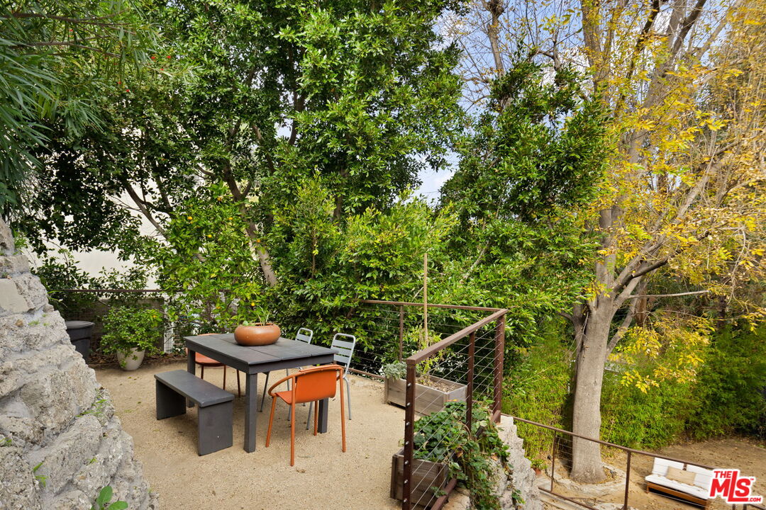 8577 Brier Drive Los Angeles, CA 90046 - Photo 38 of 39 a backyard with table and chairs and potted plants