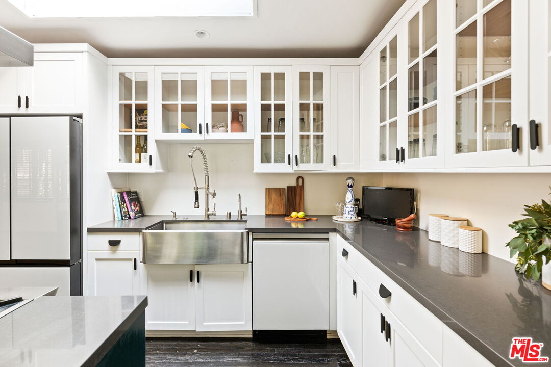 8577 Brier Drive Los Angeles, CA 90046 - Photo 8 of 39 a kitchen with stainless steel appliances granite countertop a sink and cabinets