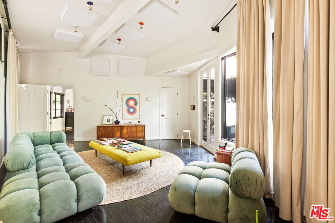 8577 Brier Drive Los Angeles, CA 90046 - Photo 10 of 39 a bedroom with furniture and a large window