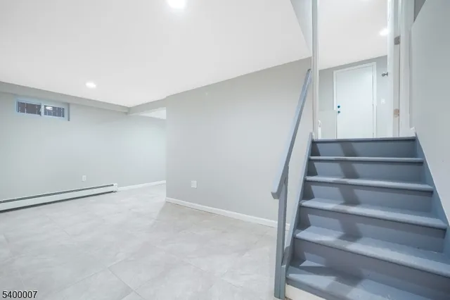 a view of an empty room with stairs