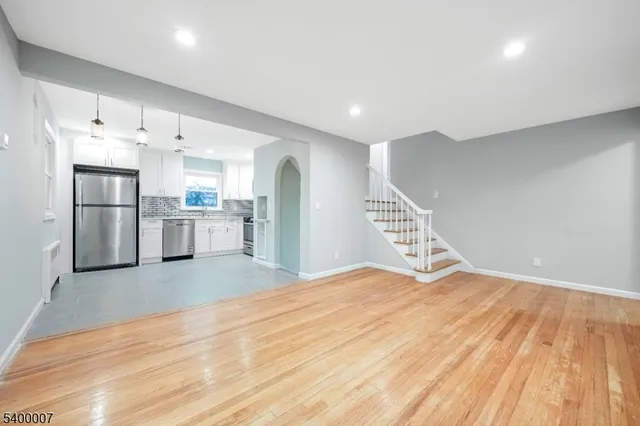 a view of kitchen with cabinets and wooden floor