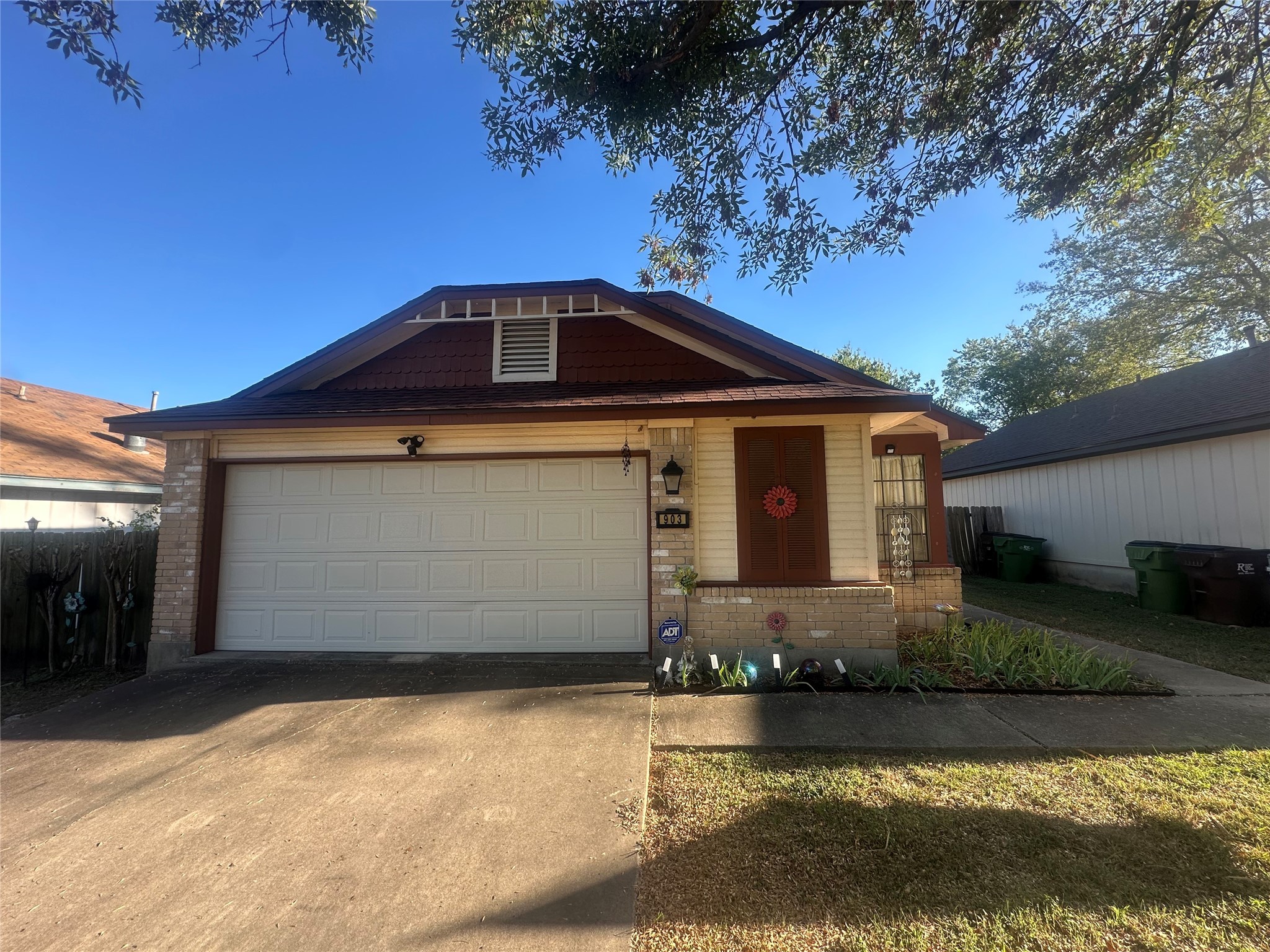903 Greenbriar Loop Round Rock, TX 78664 - Photo 1 of 19 a front view of a house with a yard