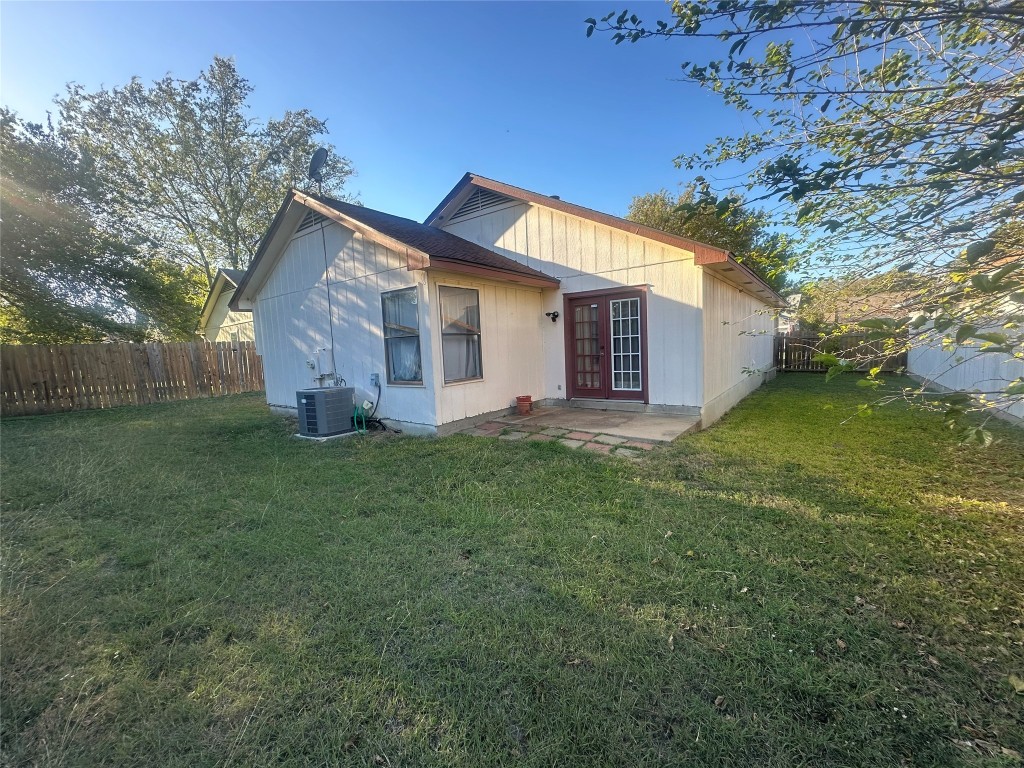 903 Greenbriar Loop Round Rock, TX 78664 - Photo 18 of 19 a view of a house with a big yard potted plants and large tree