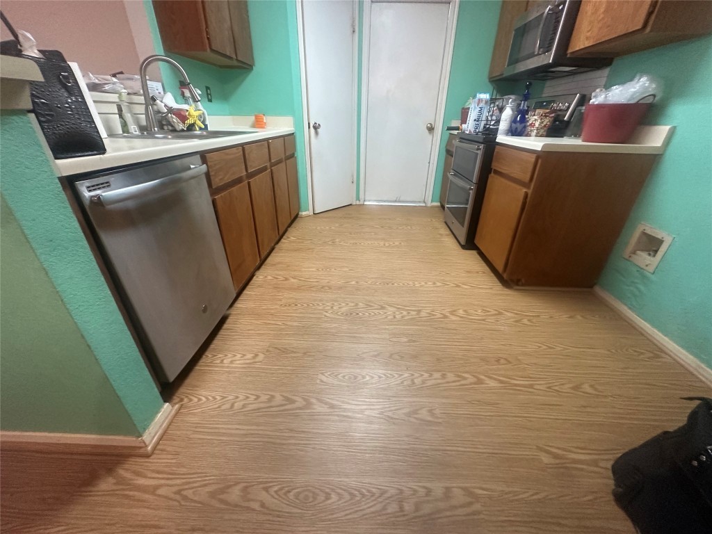 903 Greenbriar Loop Round Rock, TX 78664 - Photo 5 of 19 a utility room with sink dryer and washer