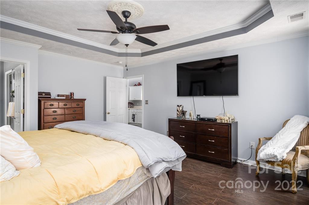 163 Trillium Road Columbia, SC 29229 - Photo 15 of 22 a bedroom with a bed and a flat screen tv