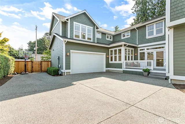 a front view of a house with a garage