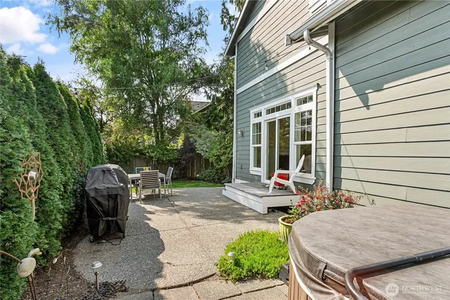 a chair and table in front of a house