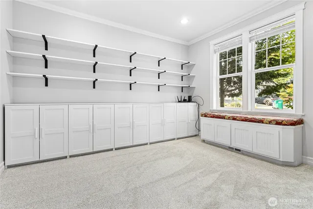 a spacious bedroom with a large bed and a window