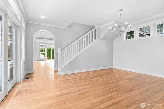 a view of entryway and hall with wooden floor