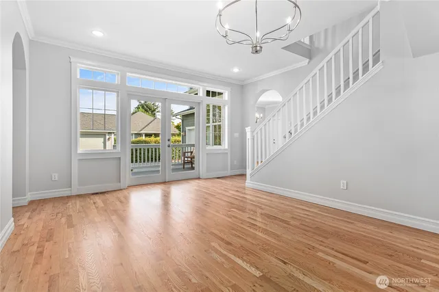 a view of an entryway with wooden floor
