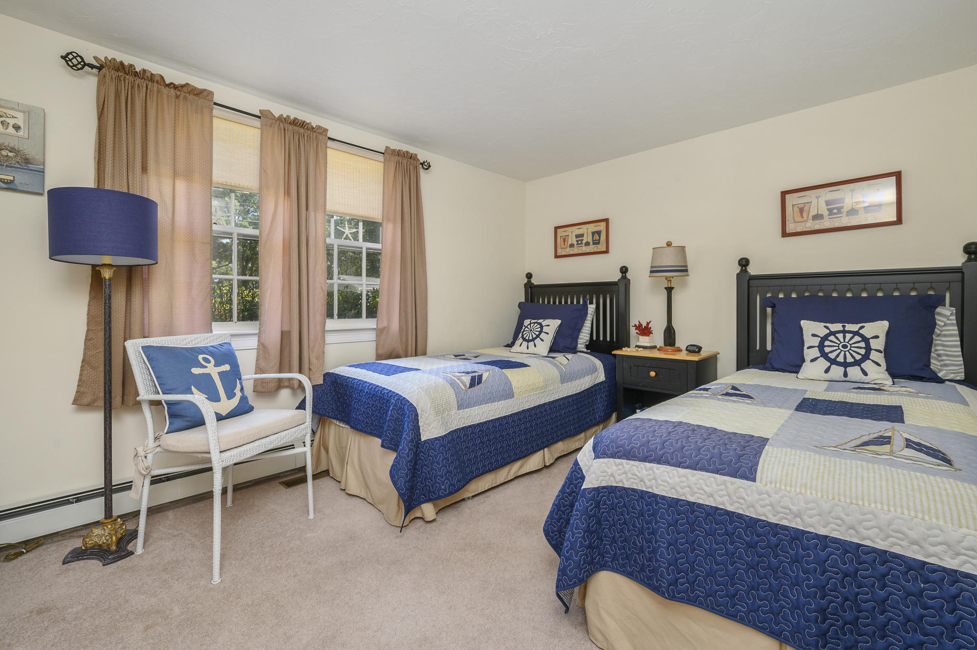 63 Fuller Road Centerville, MA 02632 - Photo 12 of 17 a bedroom with two beds and a chair