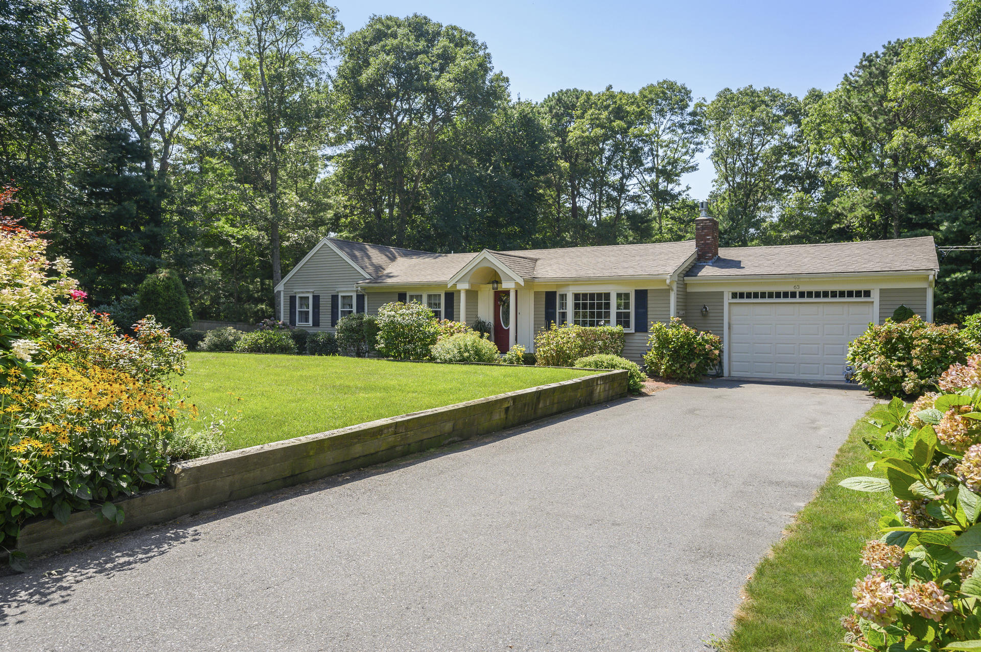 63 Fuller Road Centerville, MA 02632 - Photo 2 of 17 a view of house with outdoor space and yard