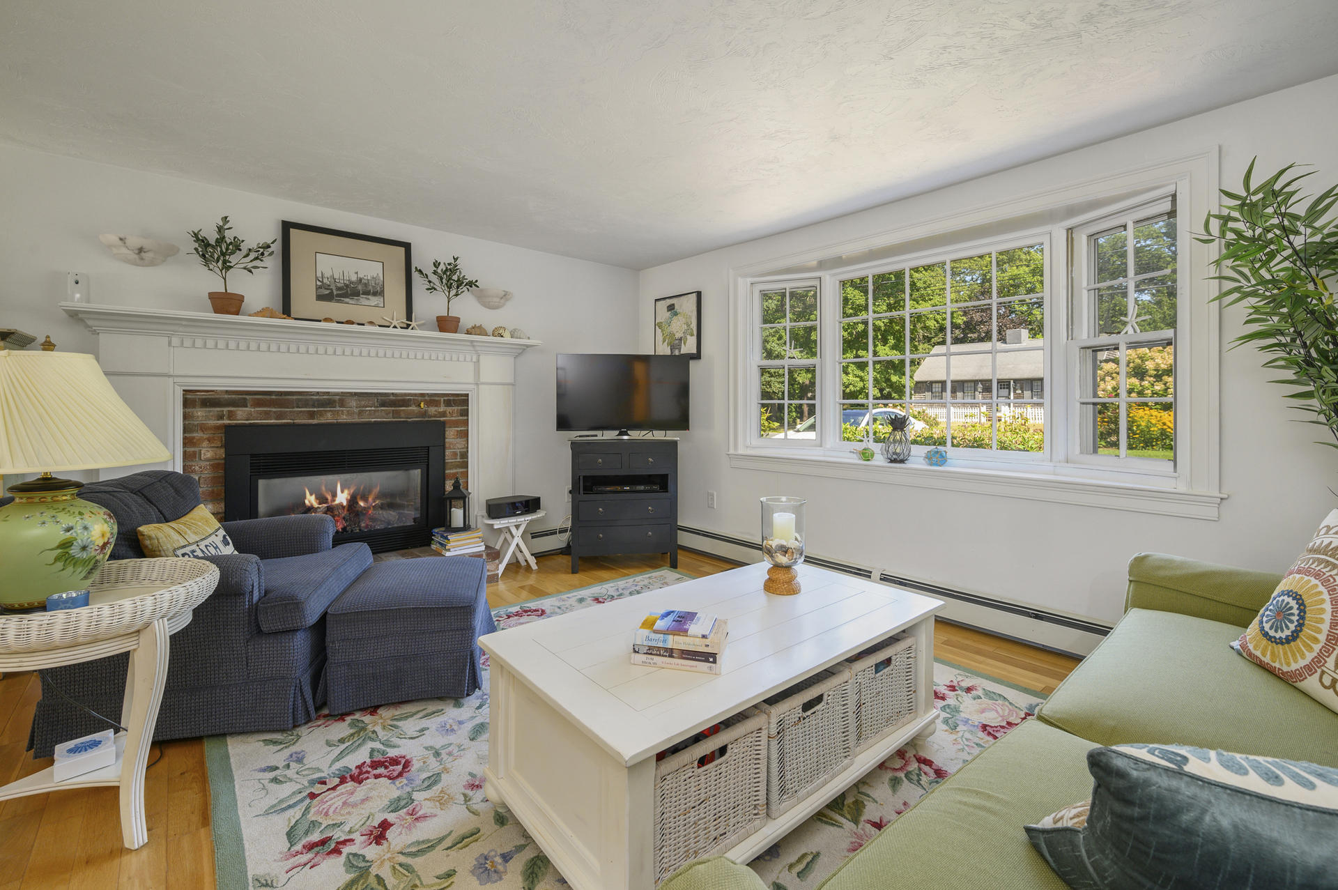63 Fuller Road Centerville, MA 02632 - Photo 6 of 17 a living room with furniture and a fireplace