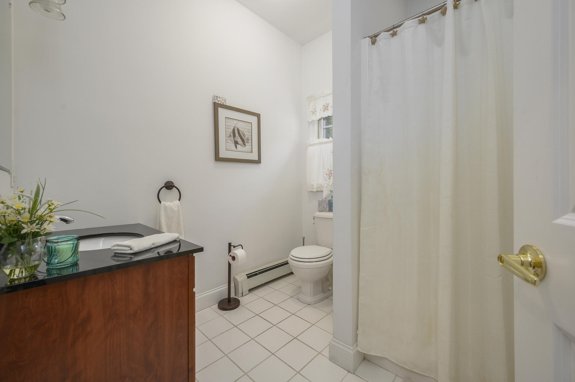 63 Fuller Road Centerville, MA 02632 - Photo 10 of 17 a bathroom with a granite countertop sink and a mirror