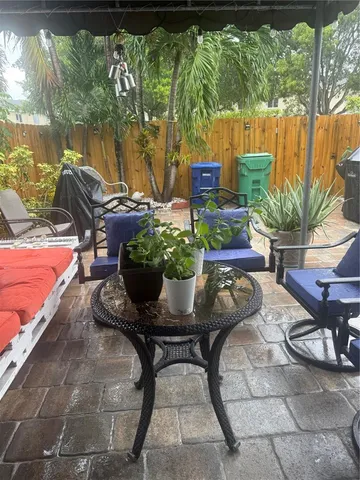 a kitchen with stainless steel appliances granite countertop a sink and a stove
