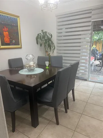 a kitchen with stainless steel appliances granite countertop a sink and a stove