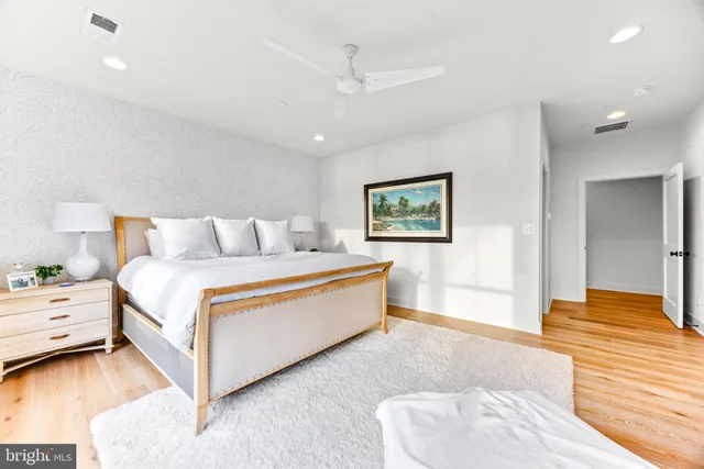 a bedroom with a bed and a dresser