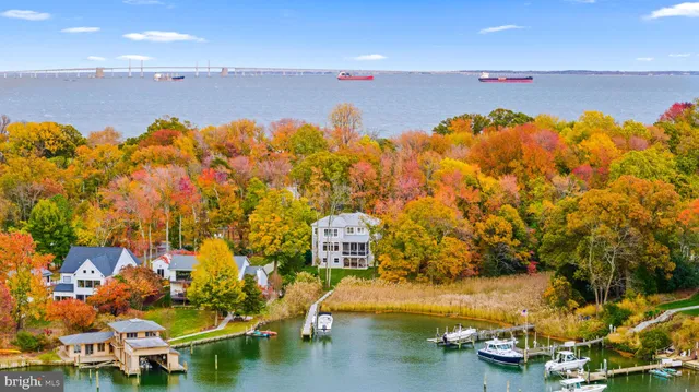 an aerial view of a house with a lake view