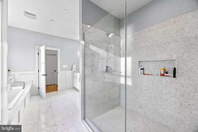 a bedroom with a bed and a dresser next to it