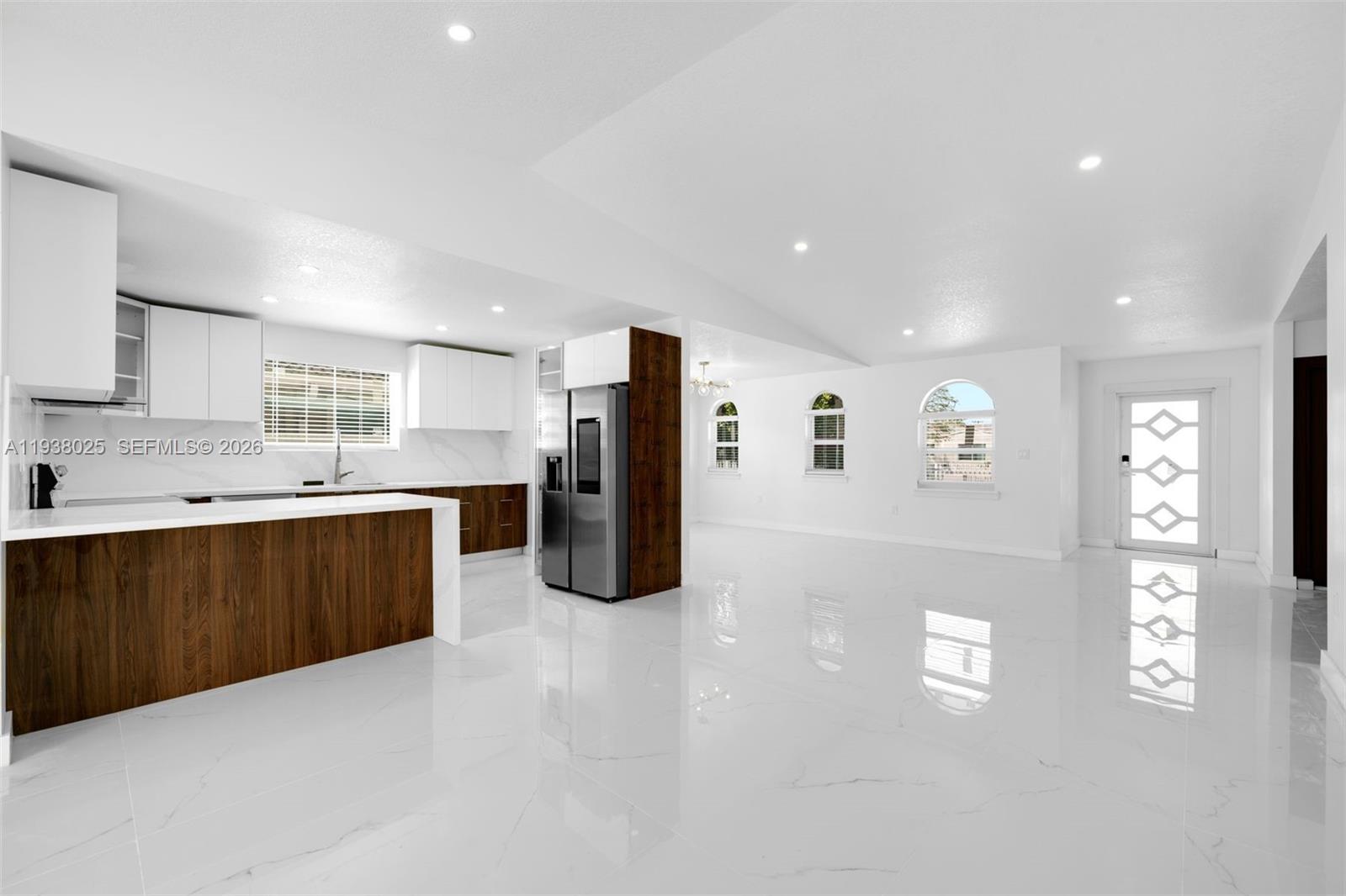 2356 Southwest 24th Street Miami, FL 33145 - Photo 11 of 36 a large white kitchen with lots of counter space and window