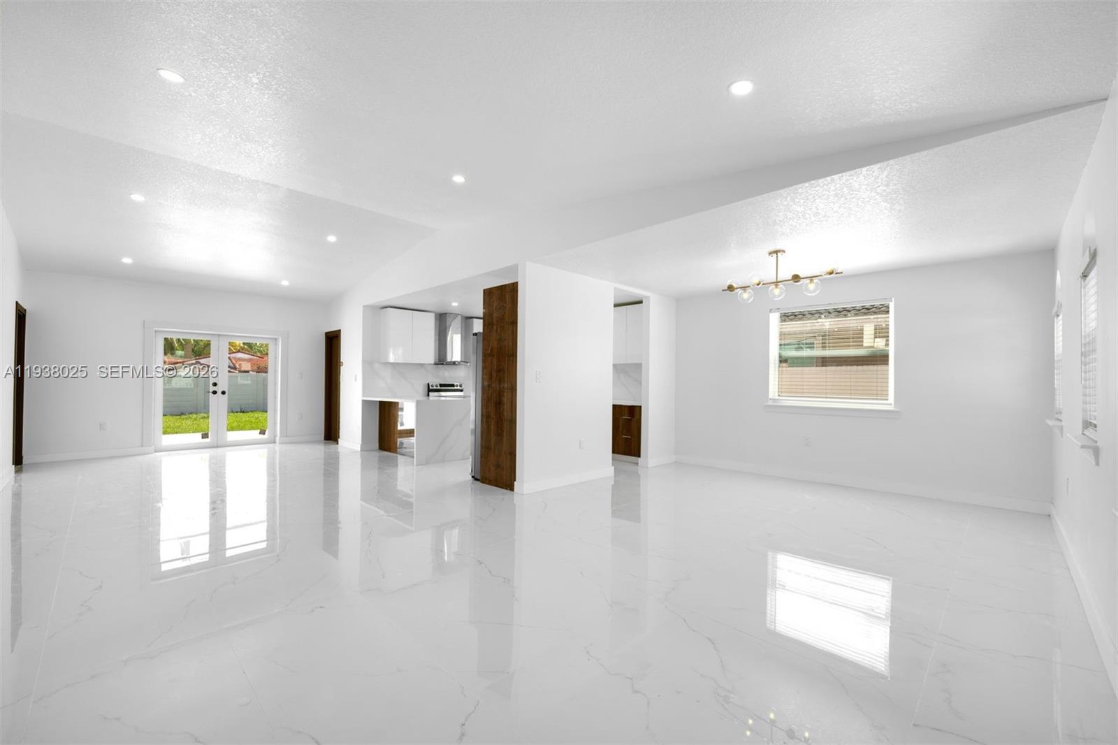 2356 Southwest 24th Street Miami, FL 33145 - Photo 8 of 36 a view of an empty room with a window