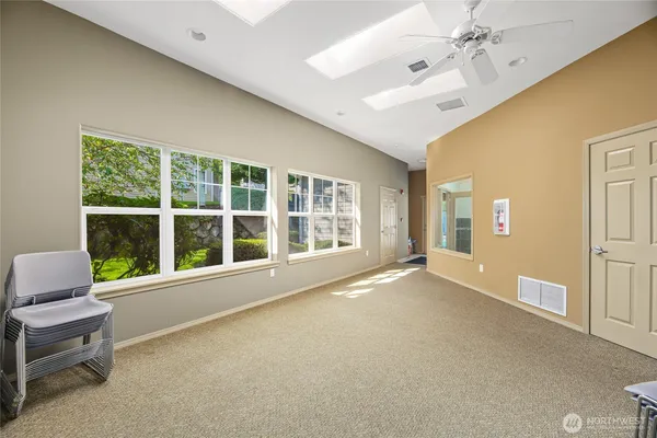 a view of an empty room with a window