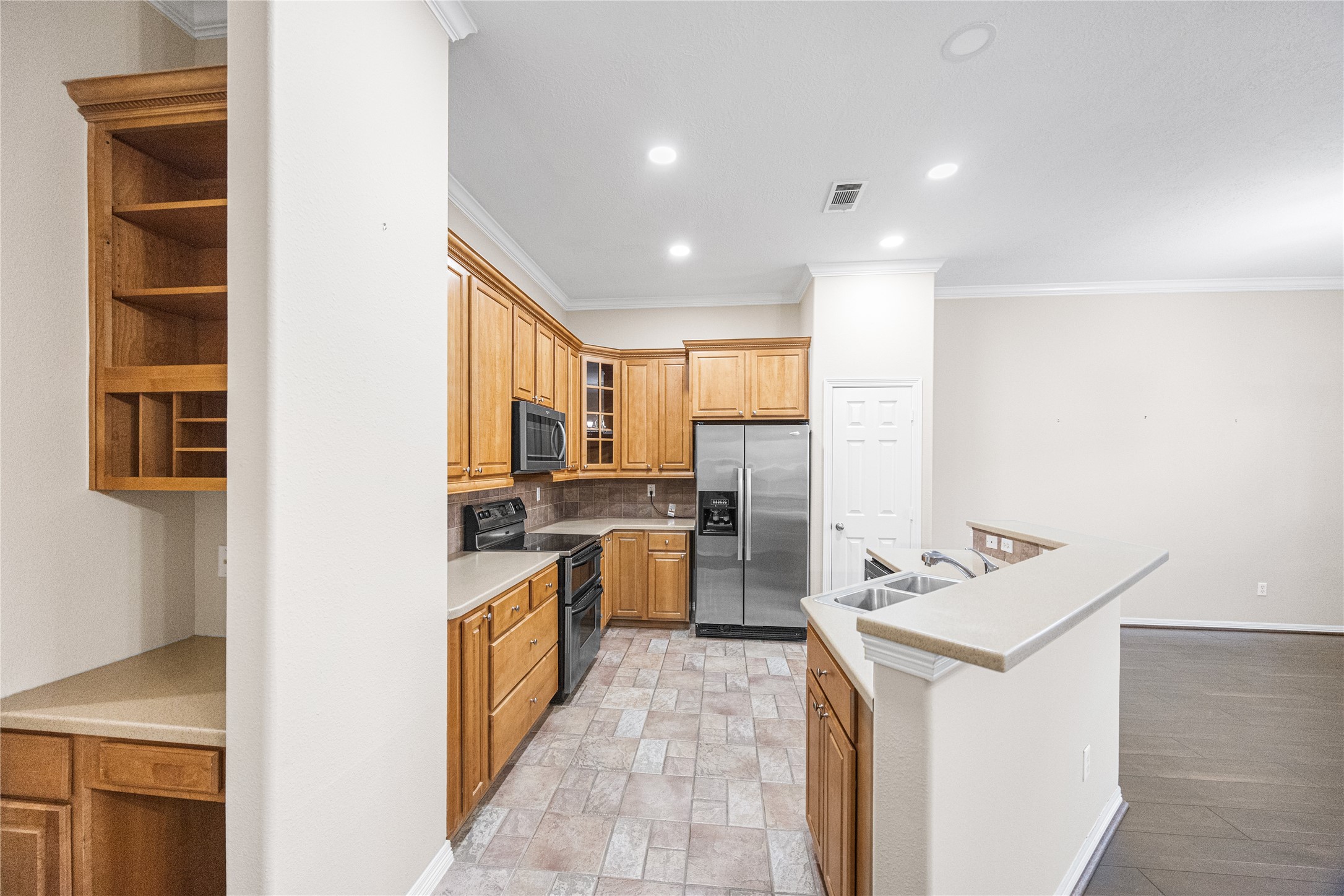 12755 Mill Ridge Drive, Unit 703 Cypress, TX 77429 - Photo 16 of 31 a kitchen with a sink and counter top space